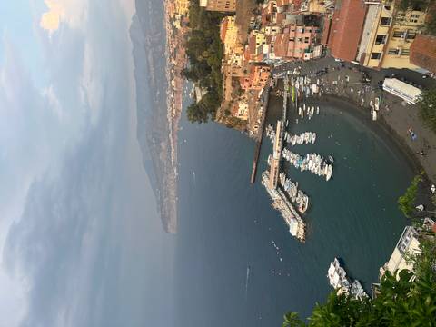 Aerial view of a harbor with boats docked.