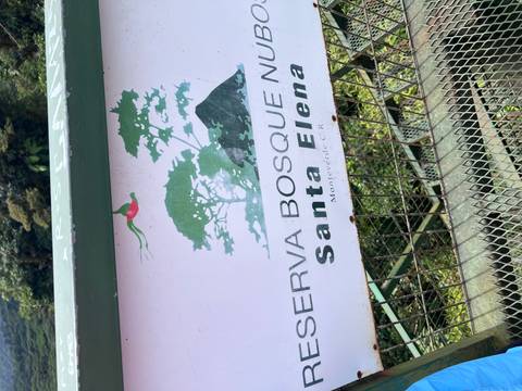       Sign for Santa Elena Cloud Forest Reserve on a railing.
  