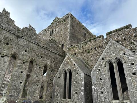       Ancient stone structure with arched windows.
  