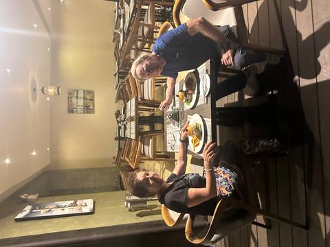 Couple sitting at a dining table in a restaurant.