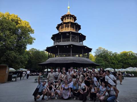 Large group in front of the Chinese Tower in Munich's English Garden.