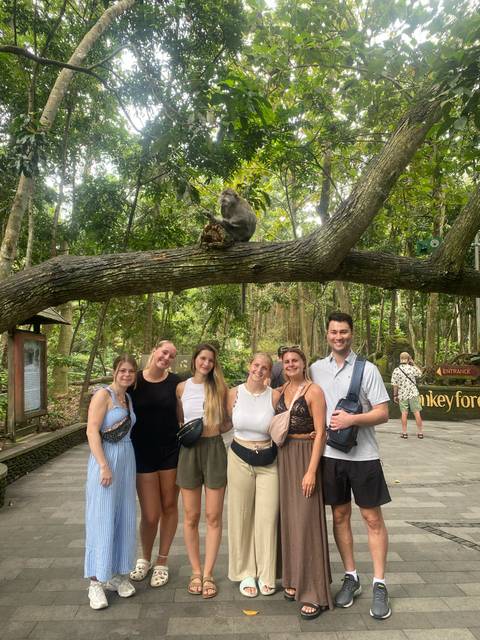 Group with monkeys at a monkey forest.