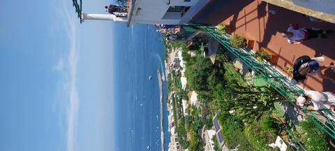 View of the coastline from a higher elevation in a town.