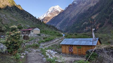 Mountain view with small houses in a valley in Nepal.