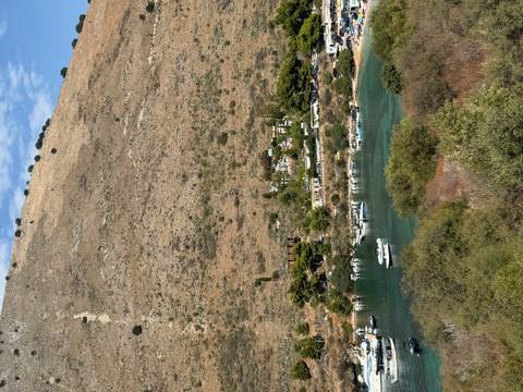 Coastal view with small boats in a bay.