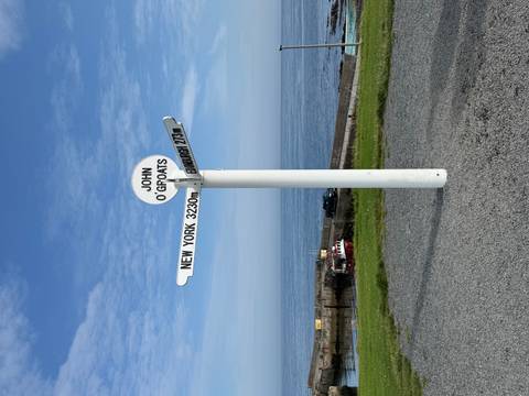Signpost marking distances to various locations at John O'Groats.