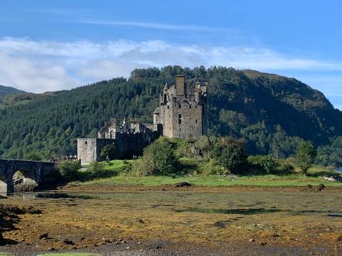       Eilean Donan Castle with lush green surroundings.
  
