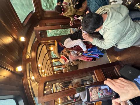       Entertainers performing onboard a train.
  