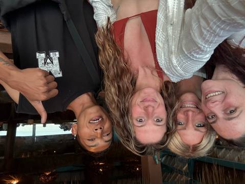 Group photo with people smiling and giving thumbs up.