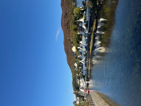 Scenic village view by a river.