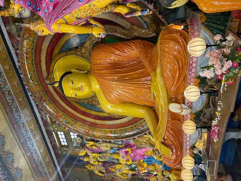 Large Buddha statue inside a temple.