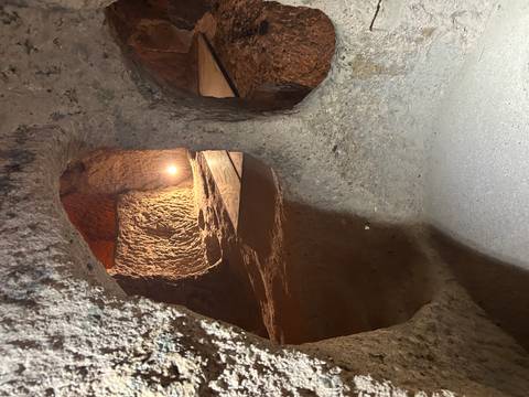       A cave interior with artificial lighting.
  