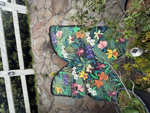 Mural of colorful flowers painted on a wall.