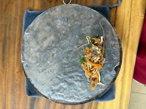       Mixture of ingredients prepared on a sheet for rolling.
  