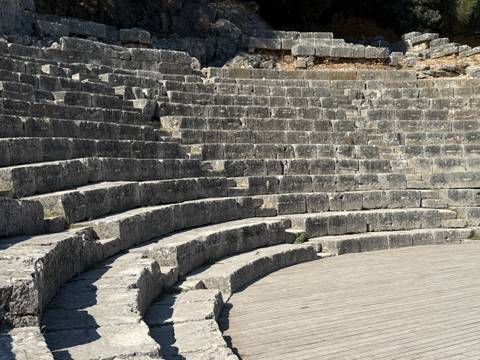 Stone amphitheater steps with circular seating.
