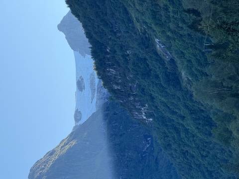 Mountain landscape with a glacier in the background.
