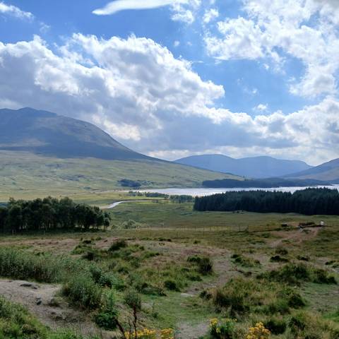 Scenic mountain landscape with a river flowing through the valley.