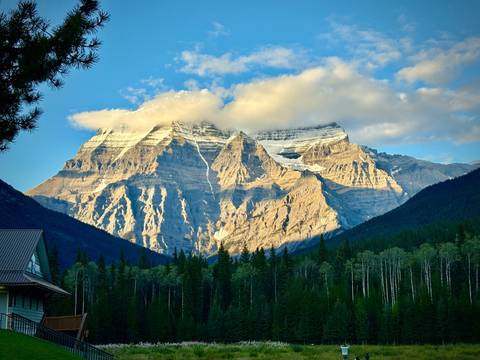 Mount Robson in the Canadian Rockies under clouds.