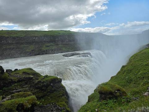 The Gullfoss waterfall with mist rising from the falls.