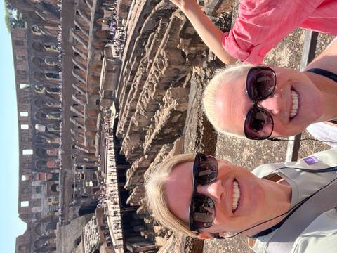 People taking a selfie inside the Colosseum.