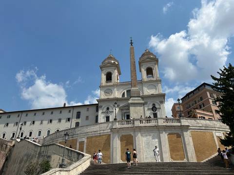 Historic building with columns and stairs.