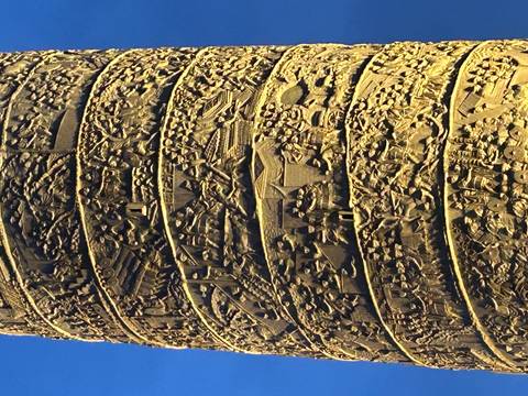 Close-up of a decorative column with carvings.