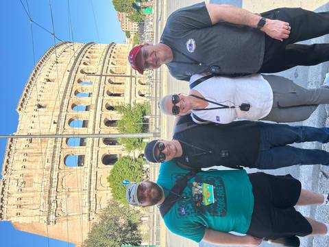 Group of tourists in front of the Colosseum.