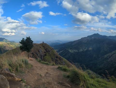 Scenic mountain range viewed from a peak.