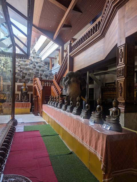 Indoor collection of Buddha statues.