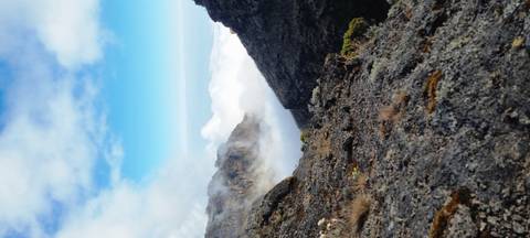 Rocky highland landscape with clouds in the background.