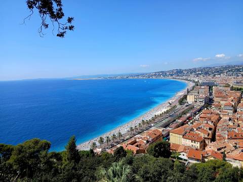 Aerial view of a coastal city with a sweeping beachfront.