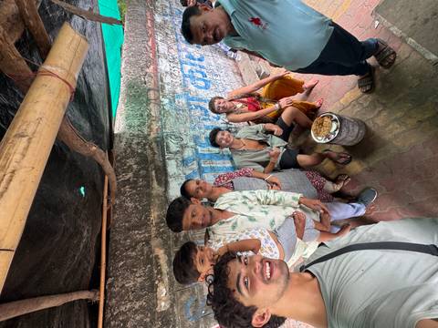       Group of diverse individuals in a vibrant setting.
  