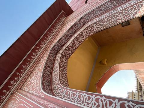       Decorative archway with intricate designs and patterns.
  