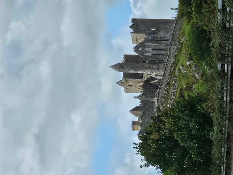 Historic stone fortifications atop a hill.