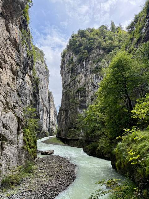 Narrow gorge with flowing river.
