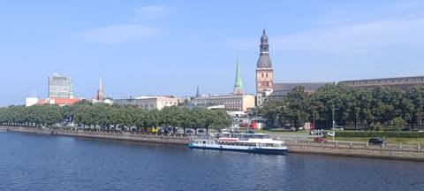 Cityscape view with a river and landmarks.