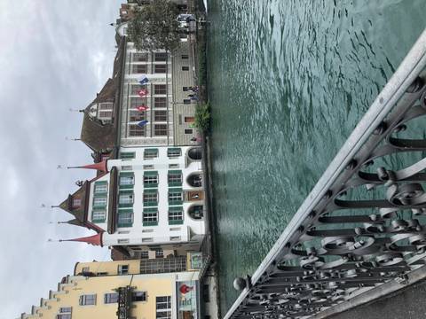 European river view with historical buildings.