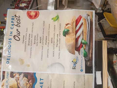 Coastal village view from a boat approaching a harbor.