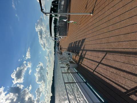 Empty seating area on a river cruise deck.