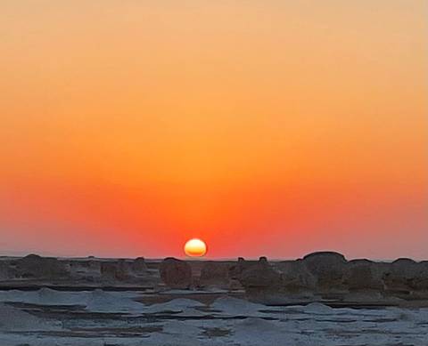 Sunset over a barren landscape.