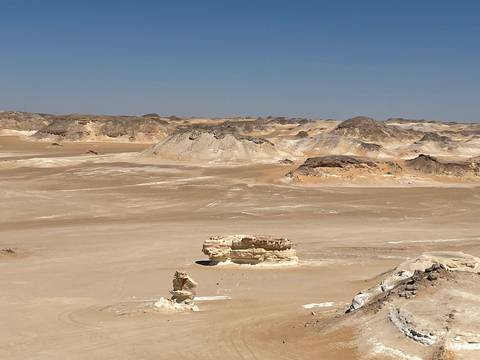 Desert landscape with rock formations.