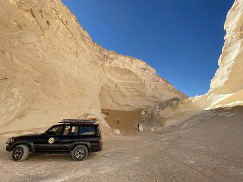 Rocky desert pass with an off-road vehicle.