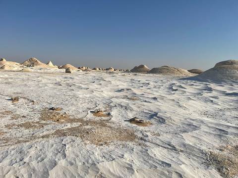 White sand desert with unique formations.