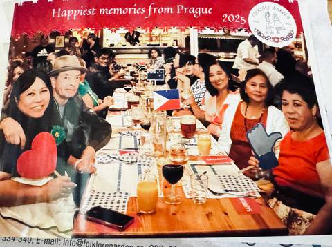 People enjoying a meal in a festive environment.