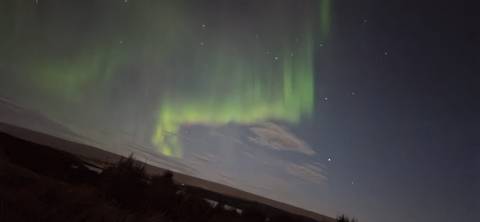 Northern Lights dancing across the night sky.