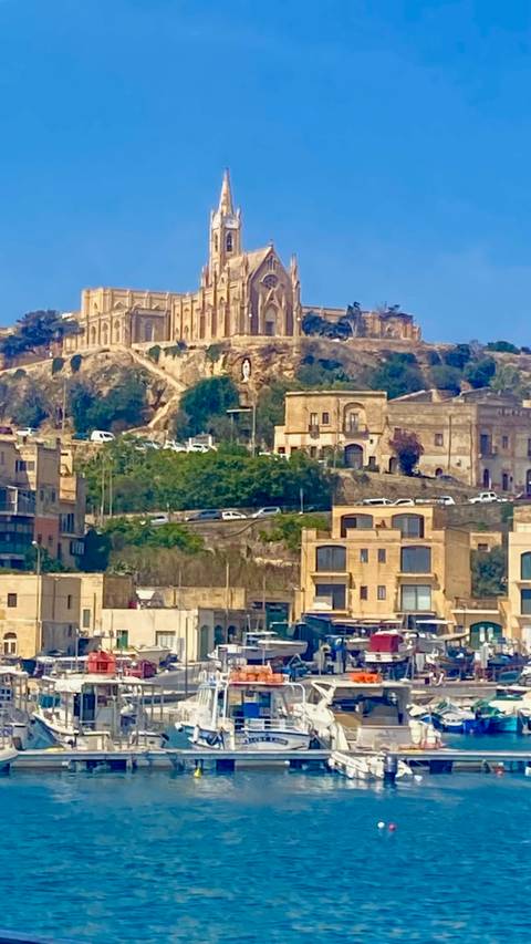 Urban view with a historic hilltop structure.