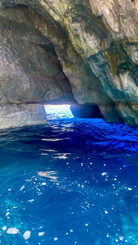 Coastal rock formation with clear waters.