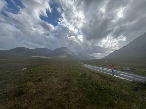       Dramatic mountain landscape with a winding road.
  