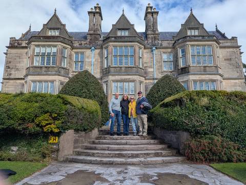 Family standing in front of a historic building