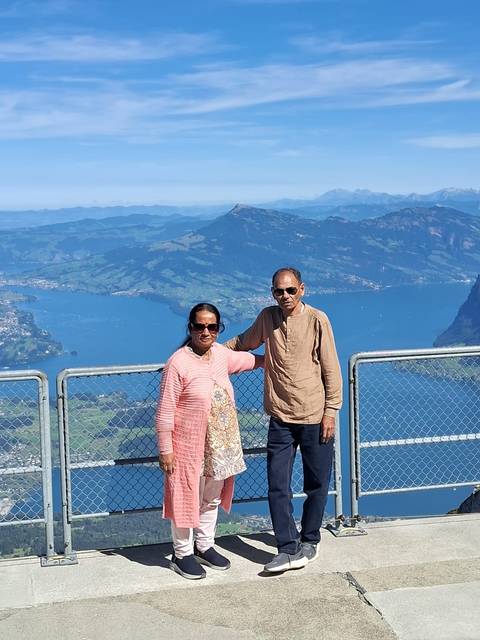 Couple posing with a mountainous landscape in the background